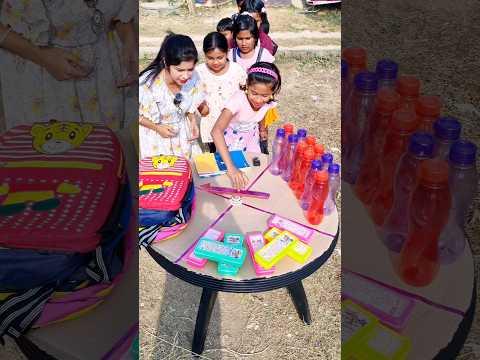 तीर घुमाओ और स्कूल की बोतल ले लो