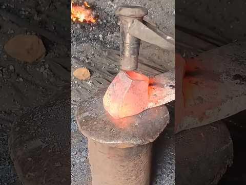 The process of forging a hole in metal